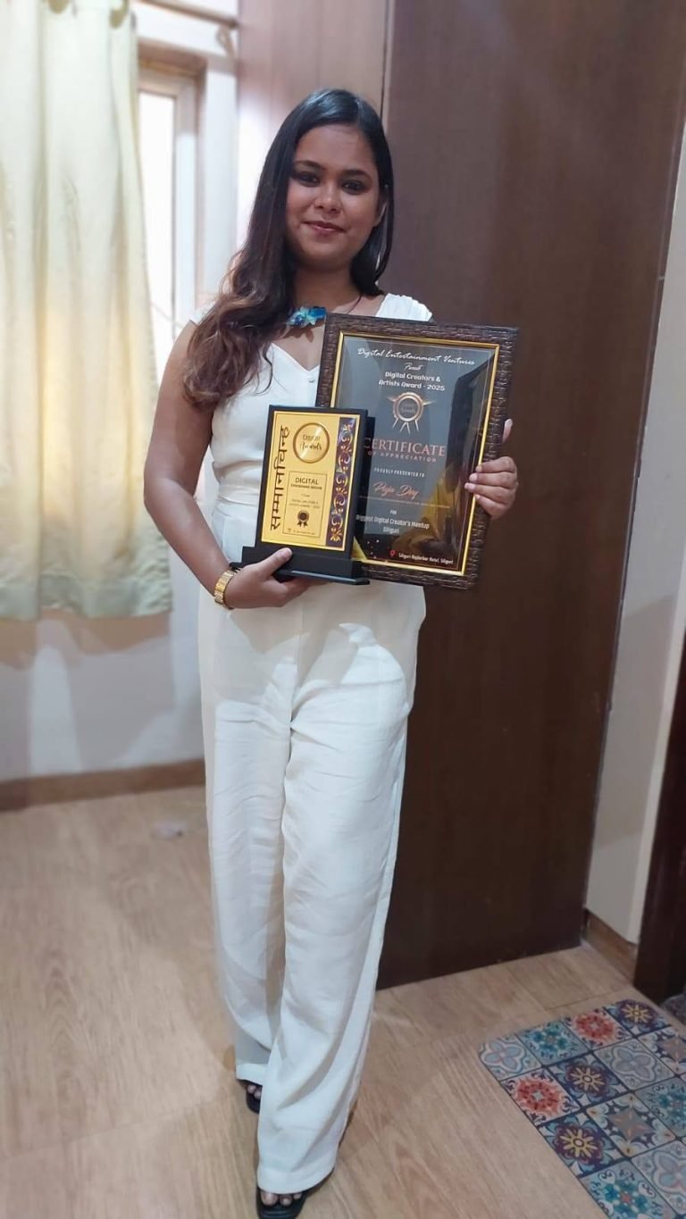 A woman in a white jumpsuit holding a framed certificate and a trophy award, smiling at the camera.